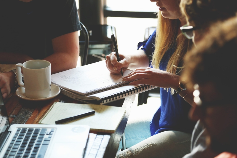 A group of people taking notes