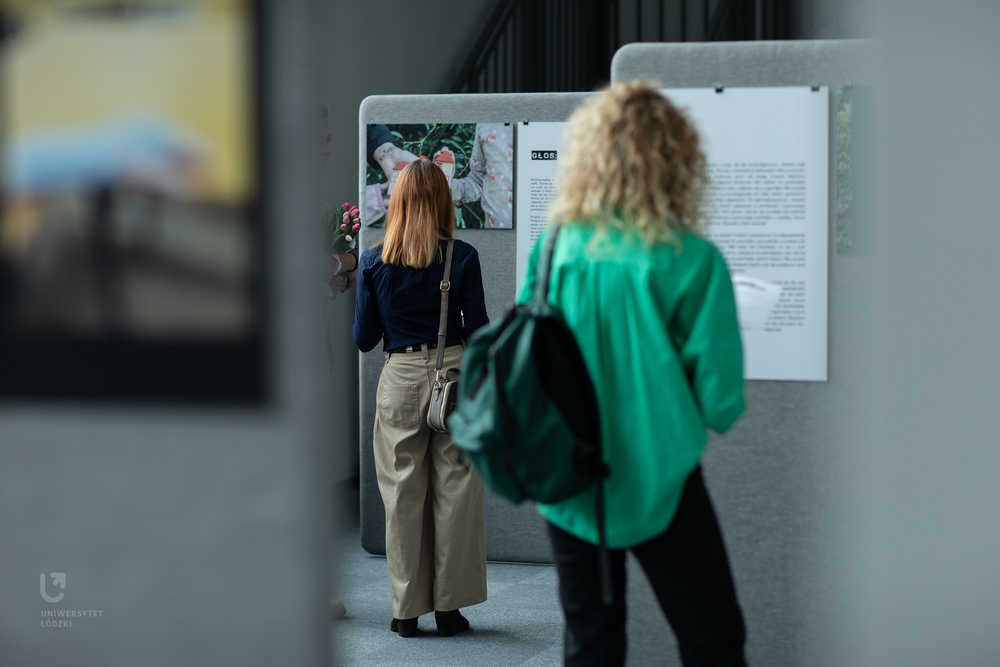 the exhibition participant while looking at the photos