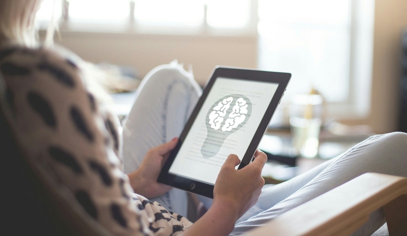 A person holding a tablet